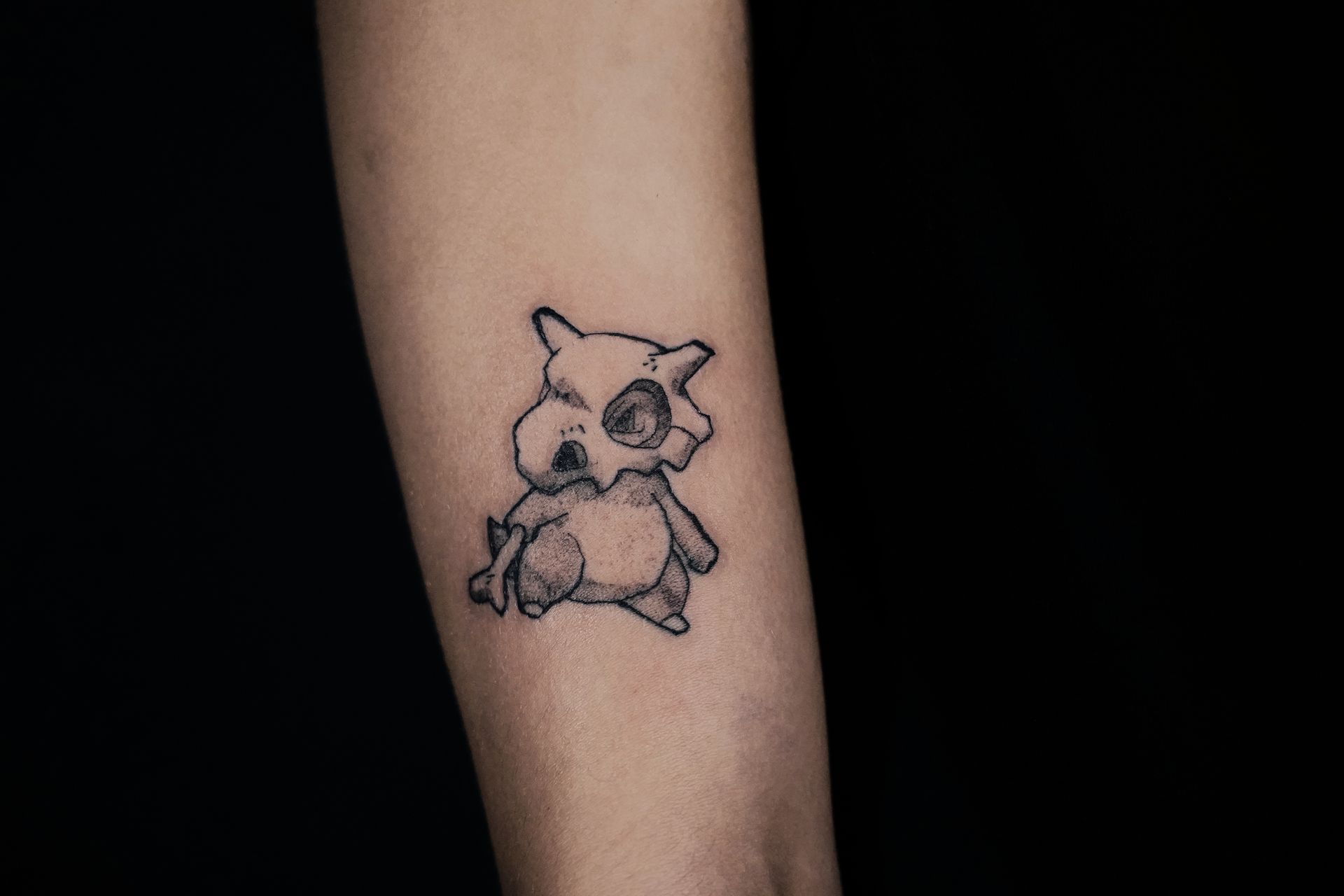 tatouage manga Osselait Pokémon avant-bras - BIW INK tatoueur Avignon